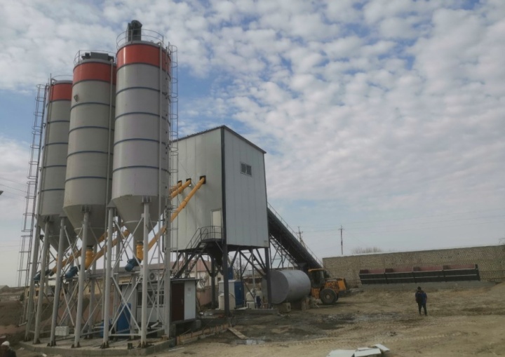 Integrated screw conveyor and belt conveyor solution for cement plant material handling